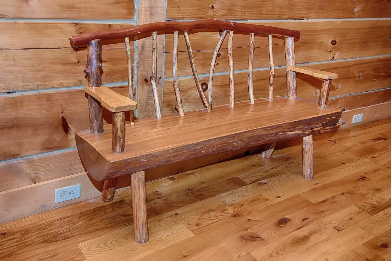 Handmade log bench built by John
