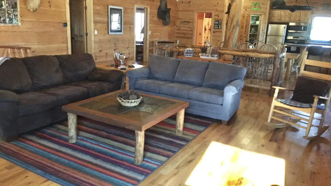 Living area with blue sofas and a handmade coffee table